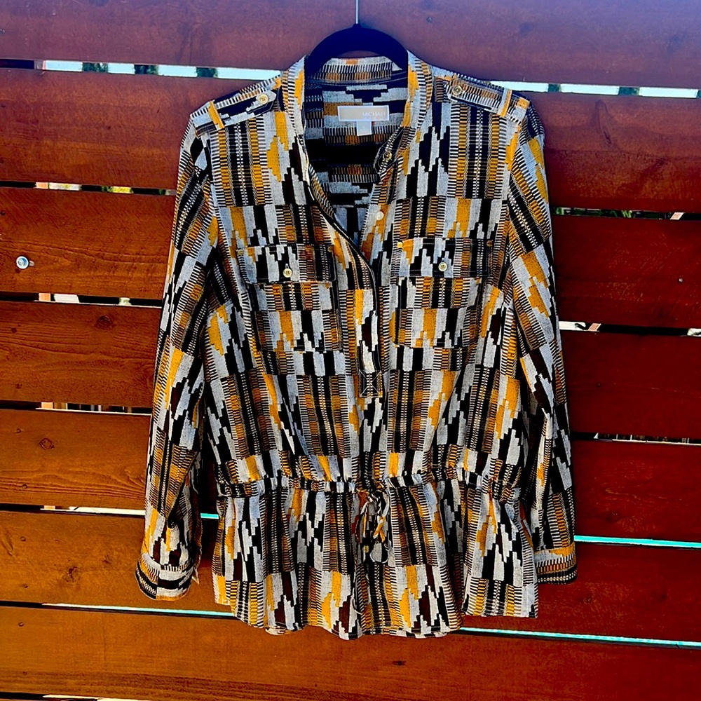 Michael Kors blouse. Never been worn. In perfect condition. Size large.